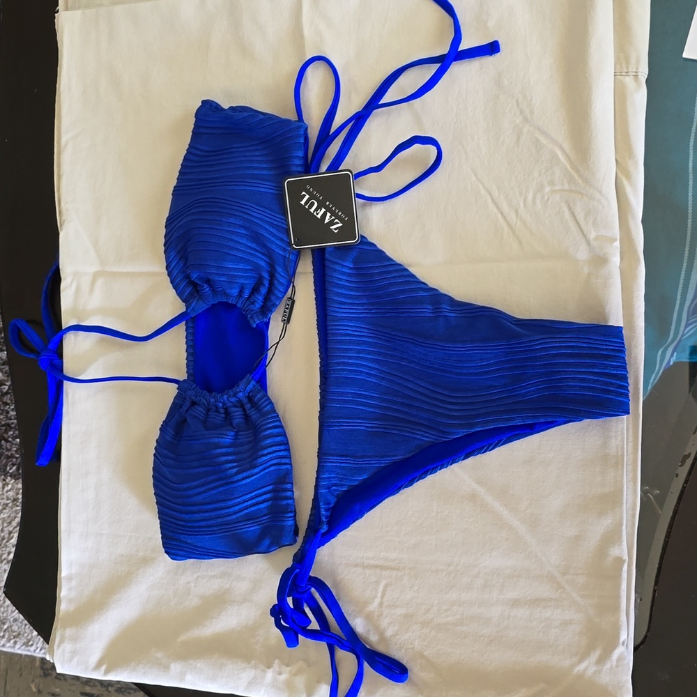 2pc bikini halter swimsuit. High cut, tie side closure. thong, padded bra,